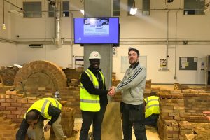 Samuel Asiamah (with hard hat) is the director of Altar Create CIC