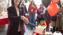 Despina Johnson, CEO of Enterprise Enfield, cuts the 40th birthday cake