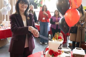 Despina Johnson, CEO of Enterprise Enfield, cuts the 40th birthday cake