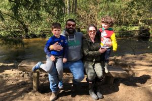 Sam (left) with his family