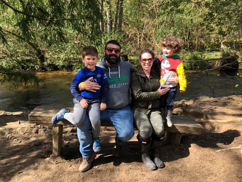 Sam (left) with his family