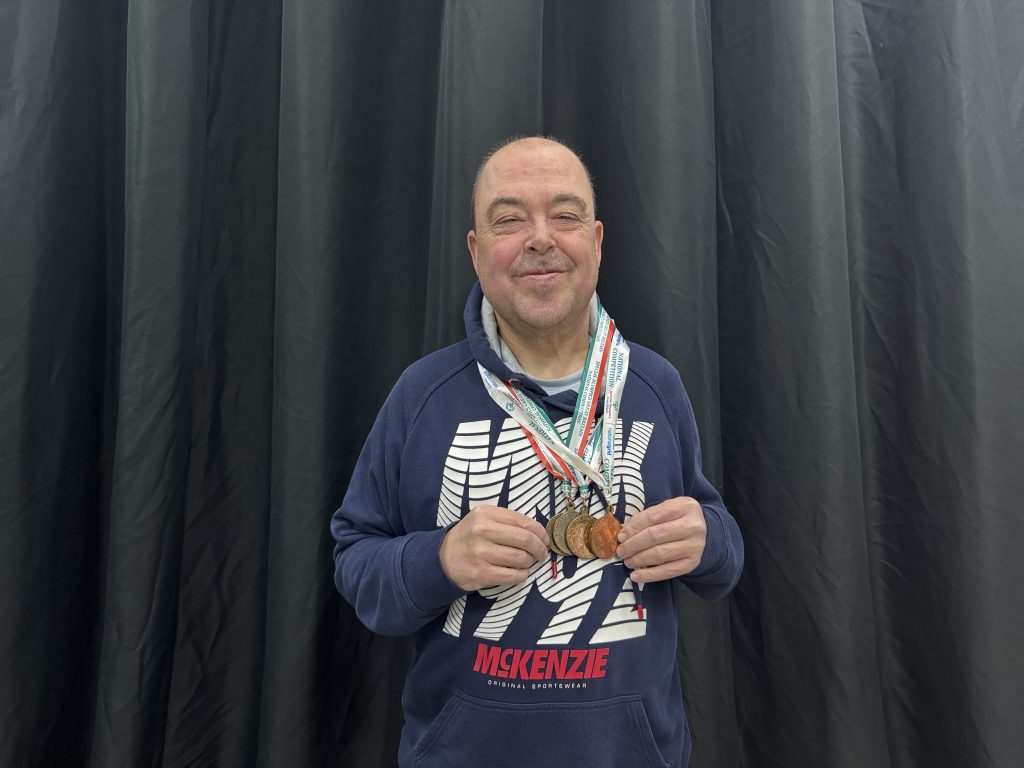 Barry Churchill with his Special Olympics medals