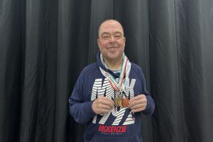 Barry Churchill with his Special Olympics medals