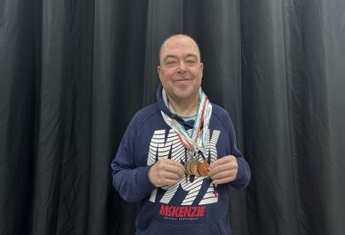 Barry Churchill with his Special Olympics medals