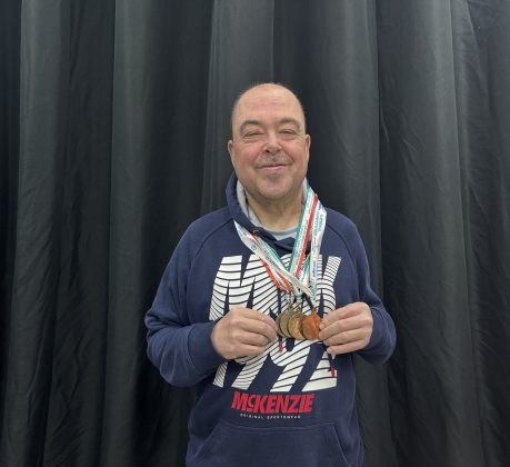 Barry Churchill with his Special Olympics medals