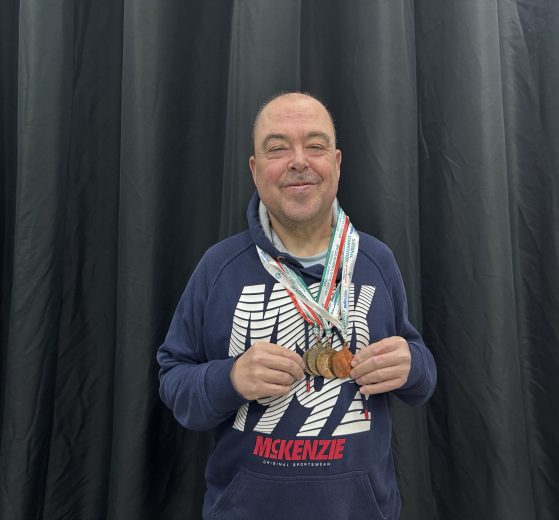Barry Churchill with his Special Olympics medals