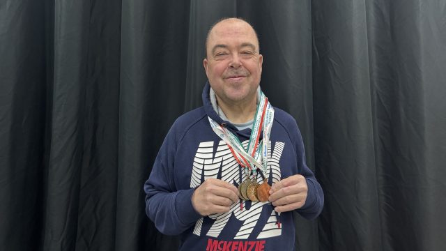 Barry Churchill with his Special Olympics medals