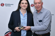Corina collects the award from Phil Veasey of Middlesex Tennis