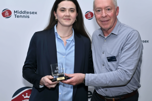 Corina collects the award from Phil Veasey of Middlesex Tennis