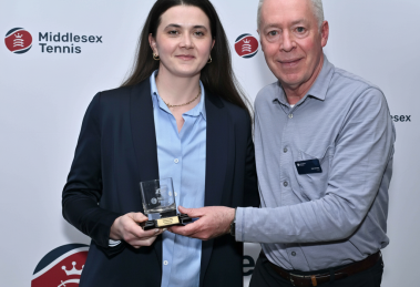 Corina collects the award from Phil Veasey of Middlesex Tennis