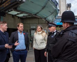 Lib Dem MP and London spokesman Luke Taylor (with blue shirt) speaks to Met Police officers (credit London Lib Dems)