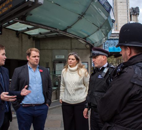 Lib Dem MP and London spokesman Luke Taylor (with blue shirt) speaks to Met Police officers (credit London Lib Dems)