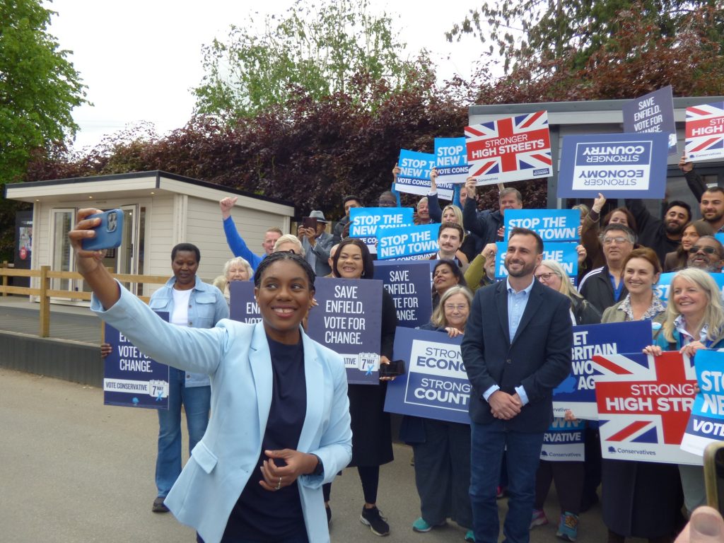 Conservate Party leader Kemi Badenoch poses for a selfie with local activists