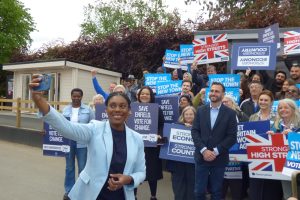 Conservate Party leader Kemi Badenoch poses for a selfie with local activists
