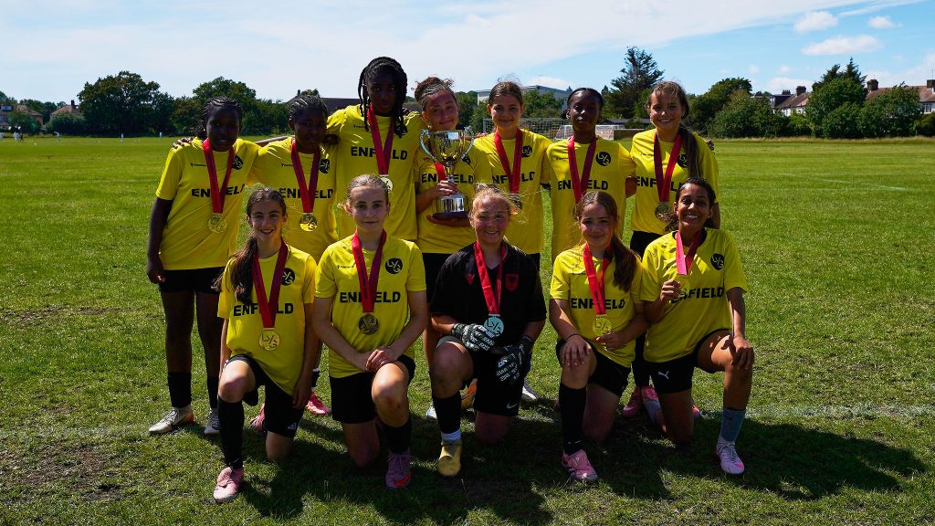 The Enfield Girls Football Youth Games team with their trophy