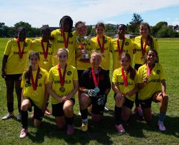 The Enfield Girls Football Youth Games team with their trophy
