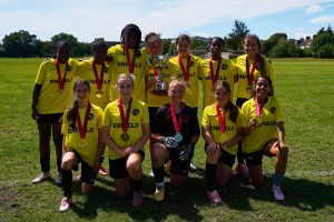 The Enfield Girls Football Youth Games team with their trophy