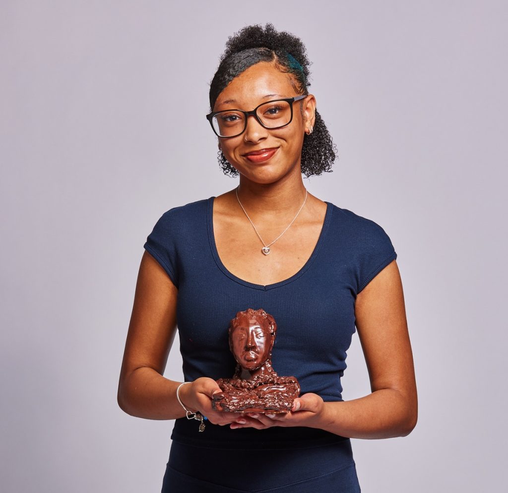 Sacelle with her sculpture 'Roots of Resilience' (credit Royal Academy of Arts)