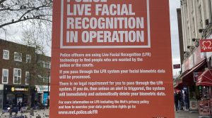 A poster warning about a live facial recognition trial