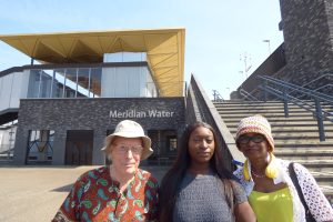 Outside Meridian Water Station, from left; React chair Alf Linney, Meridian One Homeowners Association chair Ebony Lartey, and React vice-chair Cellina Doswell