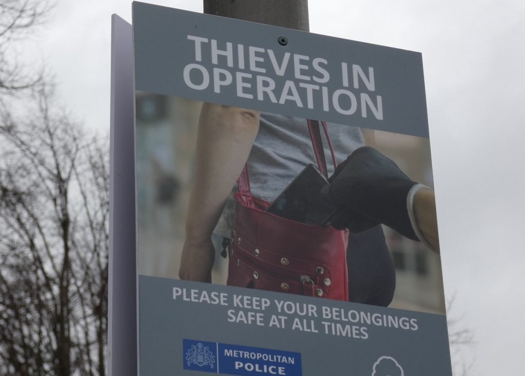 A sign warning people about phone theft
