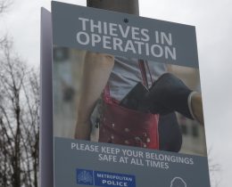 A sign warning people about phone theft