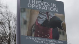 A sign warning people about phone theft