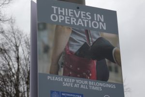 A sign warning people about phone theft