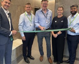 Cutting the ribbon on the new sauna is Edward Smith, the council's cabinet member for council assets