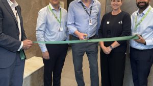 Cutting the ribbon on the new sauna is Edward Smith, the council's cabinet member for council assets