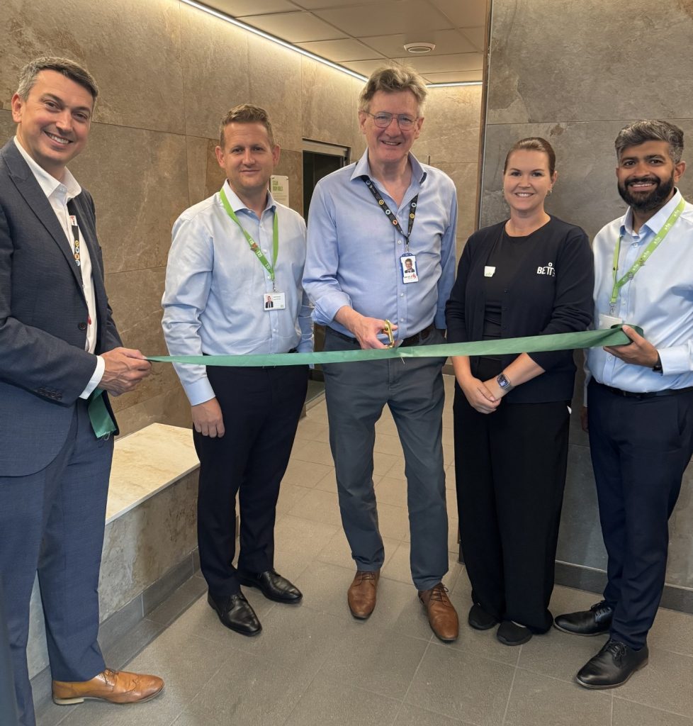 Cutting the ribbon on the new sauna is Edward Smith, the council's cabinet member for council assets