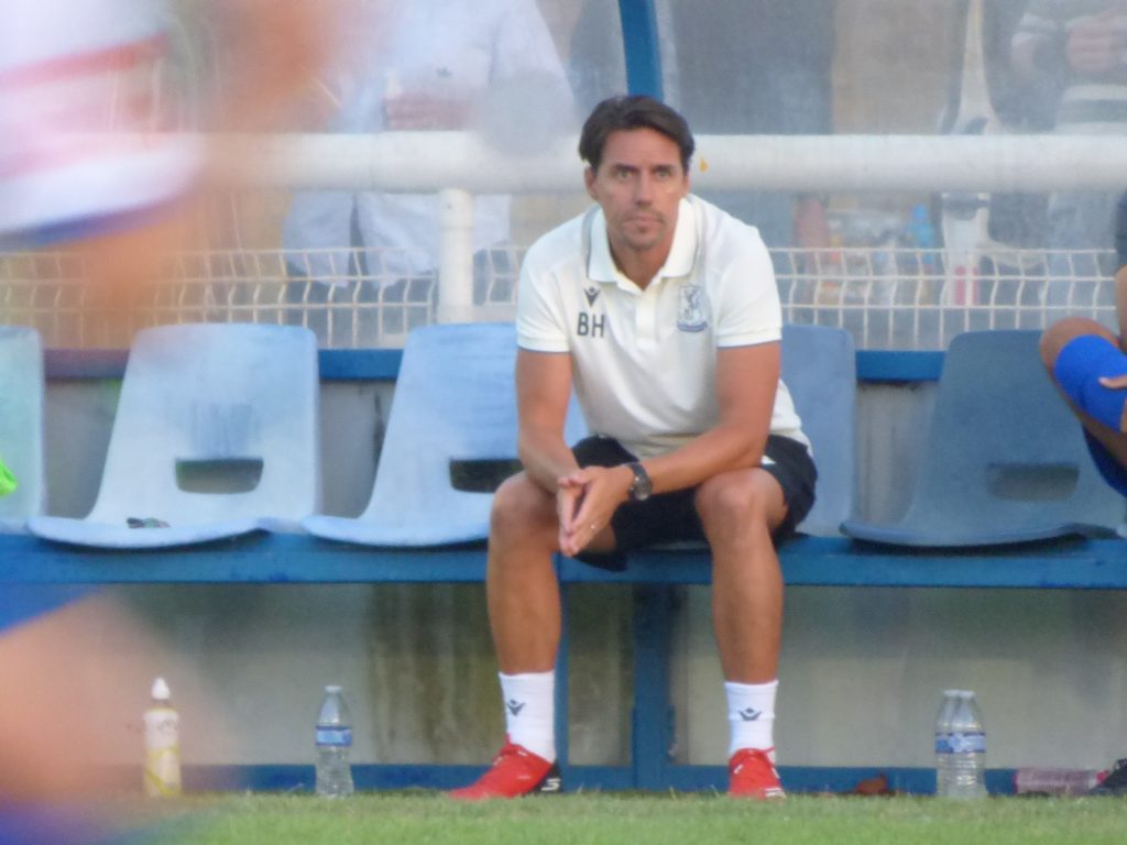 Billy Holland in the dugout at The Dave Bryant Stadium for the opening home game of the season