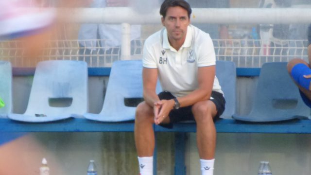 Billy Holland in the dugout at The Dave Bryant Stadium for the opening home game of the season