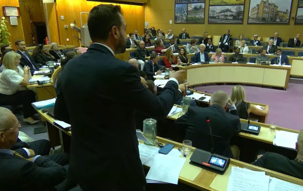 Alessandro Georgiou addresses the council chamber during Wednesday's heated debate (credit Enfield Council)