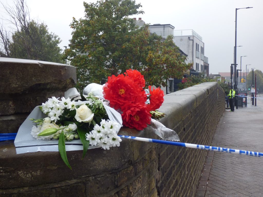 Flowers left near the scene of the shooting in Hertford Road