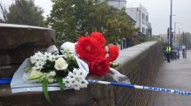 Flowers left near the scene of the shooting in Hertford Road