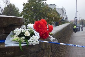 Flowers left near the scene of the shooting in Hertford Road