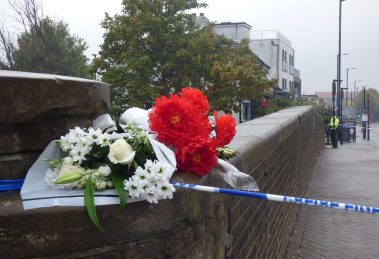 Flowers left near the scene of the shooting in Hertford Road