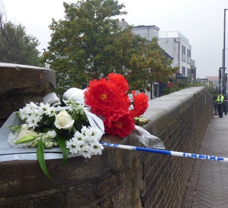 Flowers left near the scene of the shooting in Hertford Road