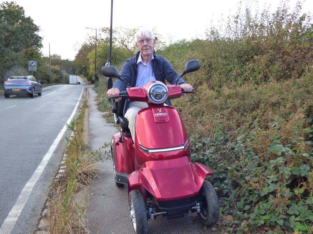 Hugh Small on his mobility scooter in Hadley Road