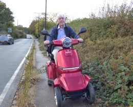 Hugh Small on his mobility scooter in Hadley Road