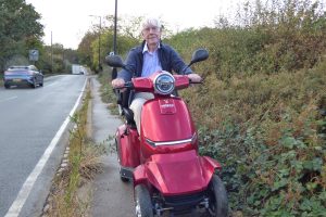 Hugh Small on his mobility scooter in Hadley Road