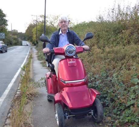 Hugh Small on his mobility scooter in Hadley Road